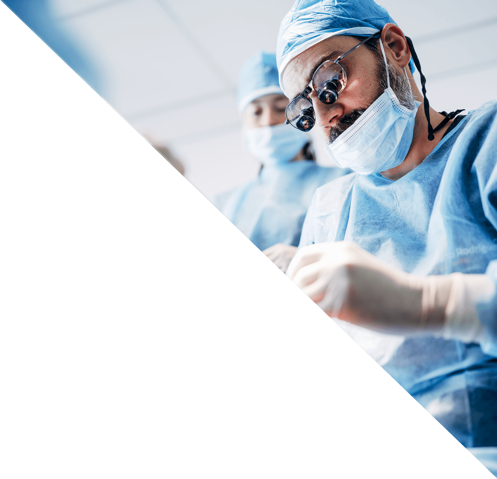 An Oral Surgeon works with his team to provide treatment to a patient.